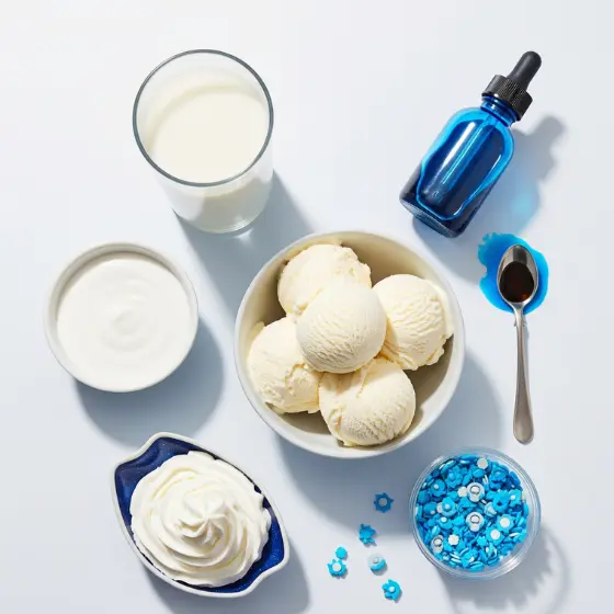 A bowl of vanilla ice cream is surrounded by a glass of milk, whipped cream, yogurt, a blue bottle, a spoon with liquid, and blue sprinkles on a white background, representing ingredients for a Blue Milkshake.